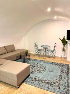 a living room with a couch and a table at Tish Hotel in Jerusalem