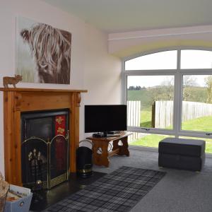 A television and/or entertainment centre at Moray Cottages