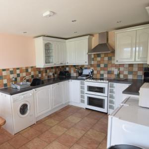 A kitchen or kitchenette at Moray Cottages