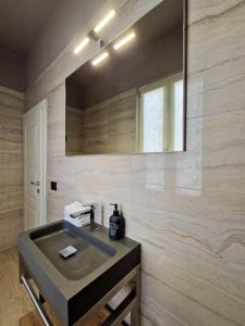 a bathroom with a sink and a mirror at Villa Sarchi in Grantola +72 photos