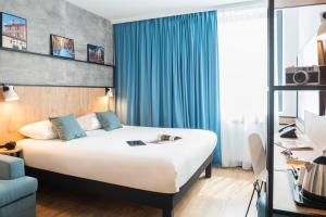 Katil atau katil-katil dalam bilik di ibis Lyon Sud Oullins