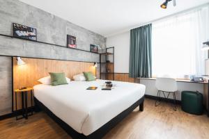 Postel nebo postele na pokoji v ubytování ibis Lyon Sud Oullins + 37 fotografií