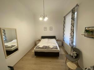Posteľ alebo postele v izbe v ubytovaní RÁD-VÁR Apartmanház