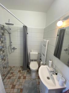 Kúpeľňa v ubytovaní RÁD-VÁR Apartmanház