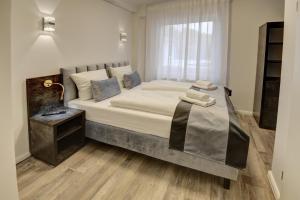 Säng eller sängar i ett rum på Pension Hygge am Hafen