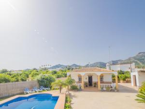 a villa with a swimming pool and a house at Cubo's Finca el Cortijito de Herrera in Alhaurín el Grande