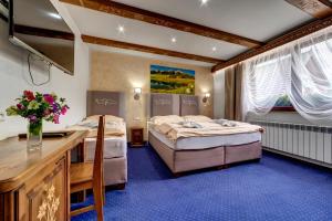 Posteľ alebo postele v izbe v ubytovaní Wellness Resort Kamzík + 37 fotografií