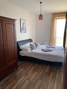 Posteľ alebo postele v izbe v ubytovaní Nikola Apartman
