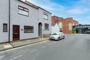 a car parked on the side of a street at Modern centrally located 3 bed property with TVs in each bedroom super fast WiFi and crisp white hotel linen hosted by Our Home Short Stays in Darlington
