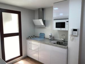Kuchyňa alebo kuchynka v ubytovaní Almansa Flat 14