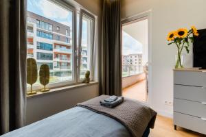 Łóżko lub łóżka w pokoju w obiekcie Apartament nad jeziorem Długim Leśna # 28