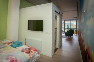 TV a/nebo společenská místnost v ubytování Bed & Breakfast Bakker Meijer