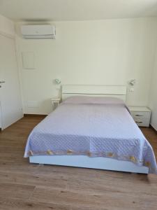 Postel nebo postele na pokoji v ubytování Villa Epi + 11 fotografií