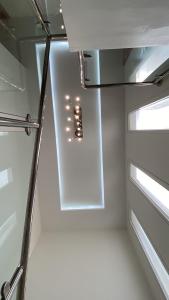 a room with a hallway with a light in it at bh villa in Al Ashkharah