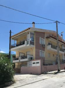 a building with balconies on the side of it at georgia's cozy rooms #2 in Kavala