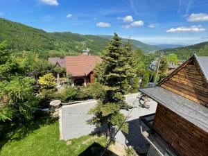 an overhead view of a house with a tree at SkiBajkowa Chata in Szczyrk