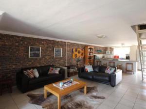 a living room with two couches and a table at Clanwilliam Accommodation in Clanwilliam