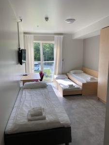 Postel nebo postele na pokoji v ubytování Lilland Hostel Tau