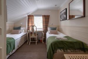 Postel nebo postele na pokoji v ubytování Olarsgården Hotell