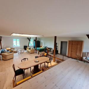 a large living room with a table and chairs at Kiekutsland in Westerholz