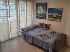 Кровать или кровати в номере Maui Beach Residence, apartamento à beira-mar em Tamandaré-PE