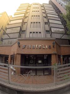 a building in front of a tall building at Filatelia Suites & Travel in Quito