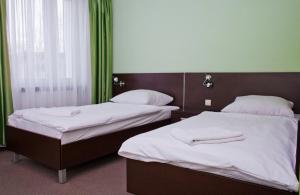 Łóżko lub łóżka w pokoju w obiekcie Centralny Ośrodek Sportu - Cetniewo we Władysławowie