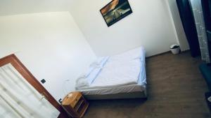 Posteľ alebo postele v izbe v ubytovaní Garden Panzió