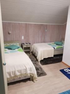 Voodi või voodid majutusasutuse Tattoo PENSION mit Restaurant und Tattoo-Studio toas