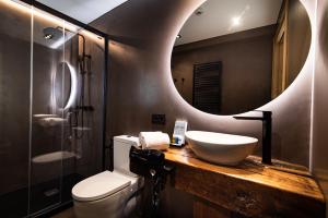 a bathroom with a sink and a mirror at Hotel Atari in Donostia-San Sebastián
