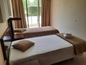 Ένα ή περισσότερα κρεβάτια σε δωμάτιο στο Salgados by The Beach +20 φωτογραφίες