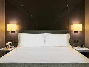 A bed or beds in a room at One96