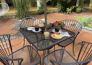 a black table with a plate of food on it at Hotel Allende Morelia in Morelia