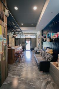 a living room with a couch and a bar at See Hualien B&B in Hualien City
