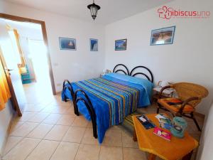 Postel nebo postele na pokoji v ubytování HibiscusUno Tropea Residence