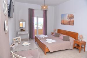 Ένα ή περισσότερα κρεβάτια σε δωμάτιο στο Sunny Rooms