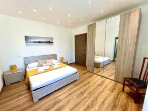 a bedroom with a bed and a mirror at Il Rio Grande in Beverino +98 photos