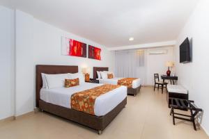 Postel nebo postele na pokoji v ubytování Hotel Playa Club