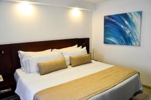 Postel nebo postele na pokoji v ubytování Hotel Playa Club
