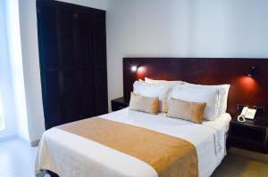 Postel nebo postele na pokoji v ubytování Hotel Playa Club
