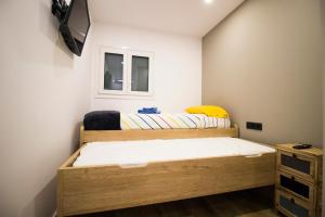 Ένα ή περισσότερα κρεβάτια σε δωμάτιο στο Apartamento Moderno a 5 min del Funicamp, 1-2