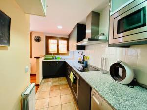Kuchyň nebo kuchyňský kout v ubytování Casa Forn