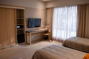 Postel nebo postele na pokoji v ubytování Gran Hotel Dakar + 37 fotografií