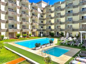 an image of an apartment building with a swimming pool at Don Gregorio in Playa del Ingles