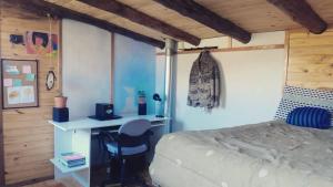 Ένα ή περισσότερα κρεβάτια σε δωμάτιο στο El Taller