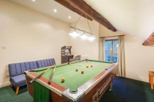 a room with a pool table with balls on it at Manor House Farm 