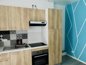 Kuchyňa alebo kuchynka v ubytovaní LE CLOS CHASSAING N1 - Wifi - Centre ville-PROPERTY RENTAL NM