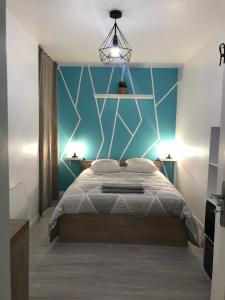 Posteľ alebo postele v izbe v ubytovaní LE CLOS CHASSAING N1 - Wifi - Centre ville-PROPERTY RENTAL NM