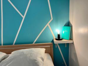 Posteľ alebo postele v izbe v ubytovaní LE CLOS CHASSAING N1 - Wifi - Centre ville-PROPERTY RENTAL NM