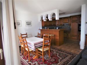 a kitchen and dining room with a table and chairs at Abschalten vom Alltag in Brissago in Brissago